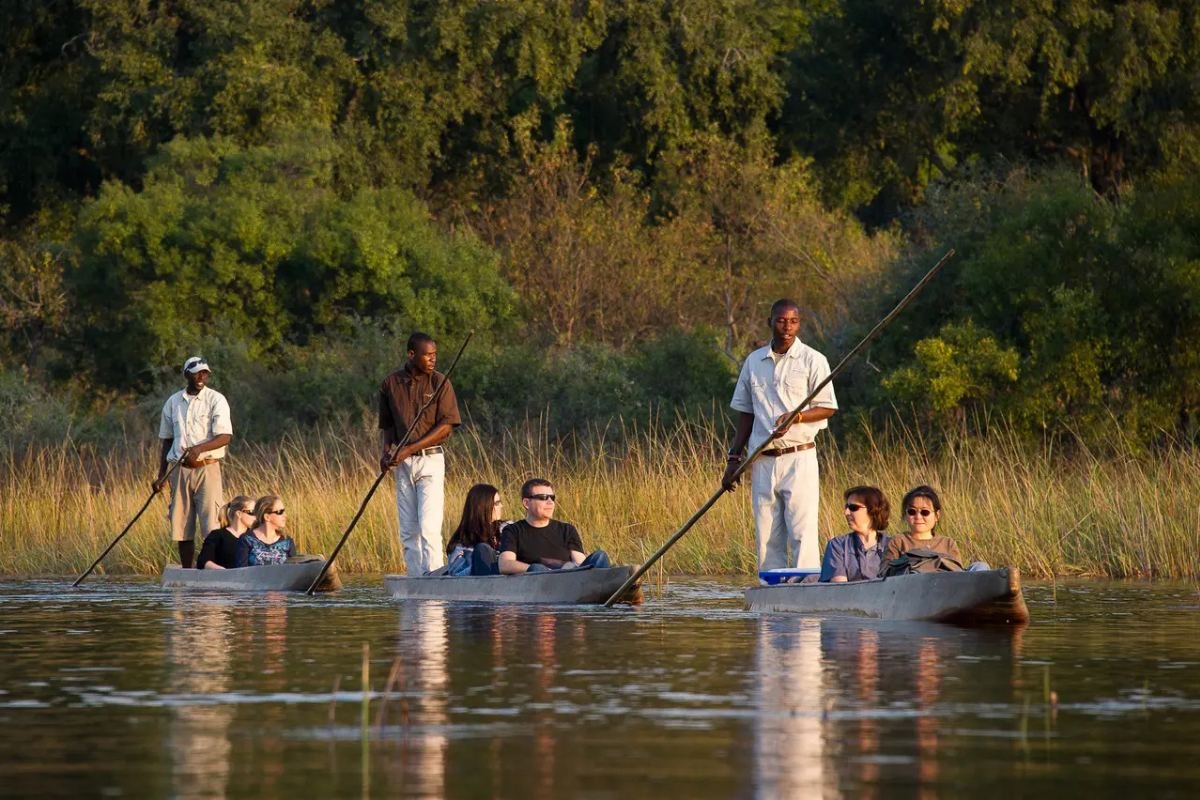 Guests taking in the Okavango Delta on a mokoro